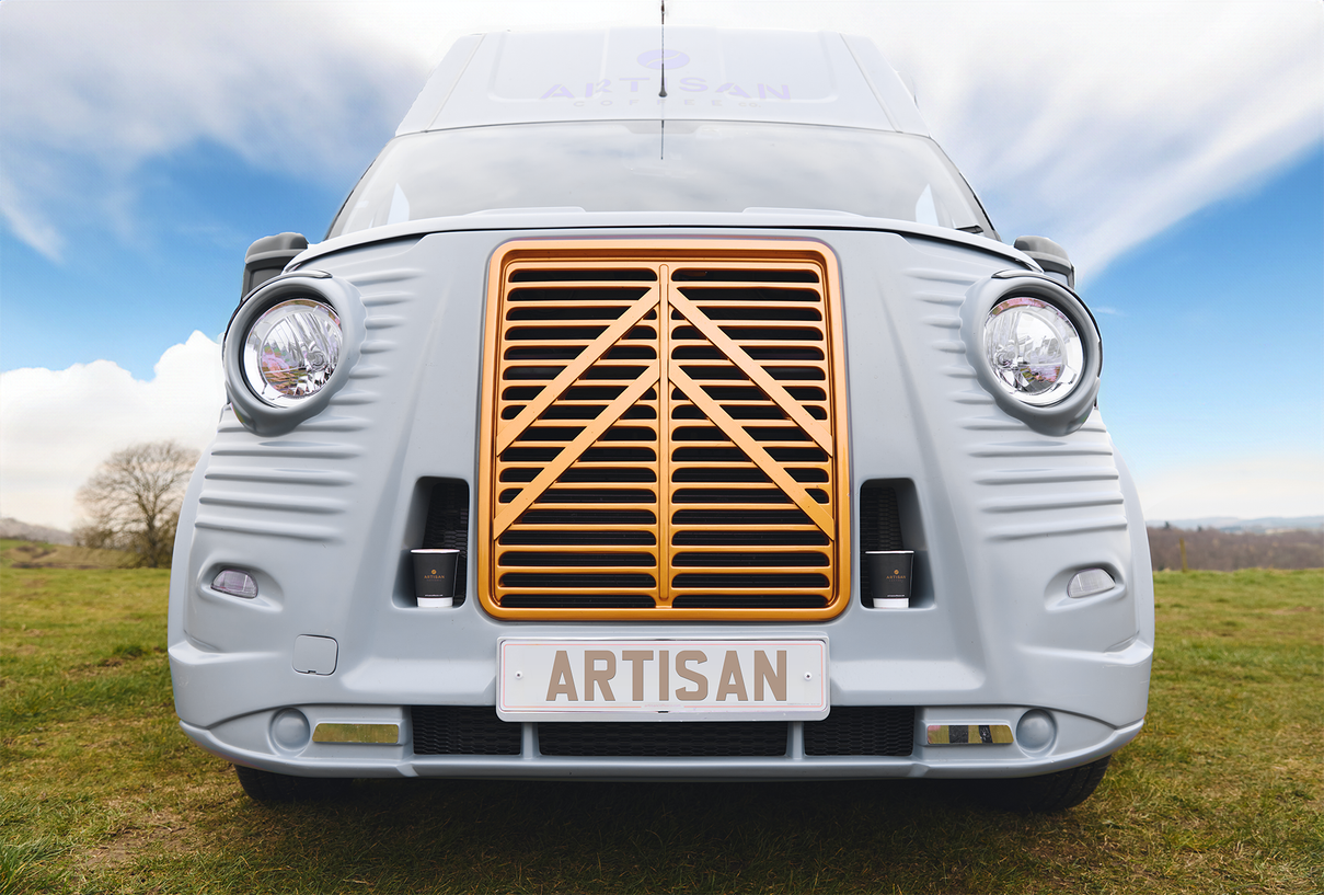 The front our Arty, our coffee van, sitting in a green field waiting for your event