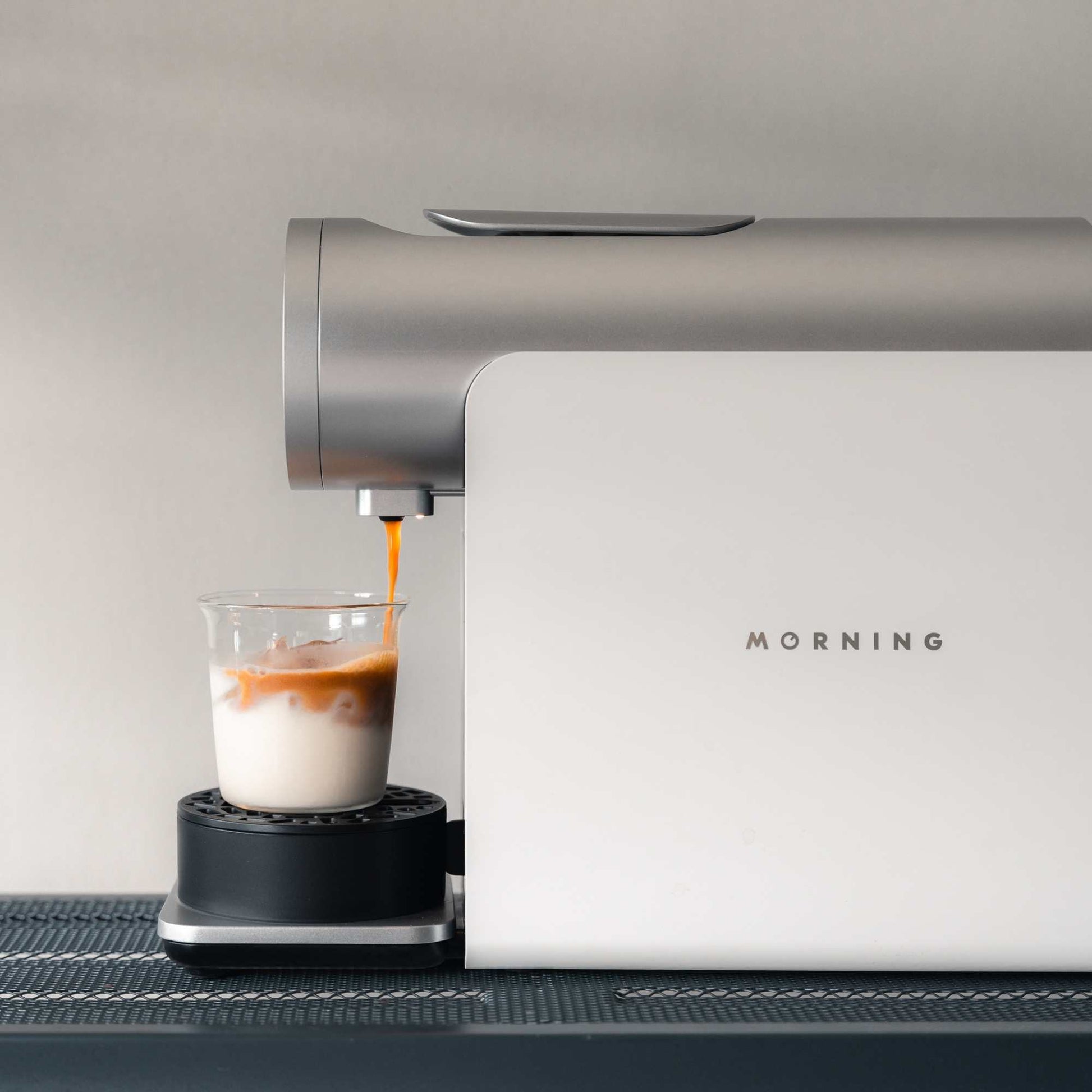 Morning Pod Machine in white pouring coffee