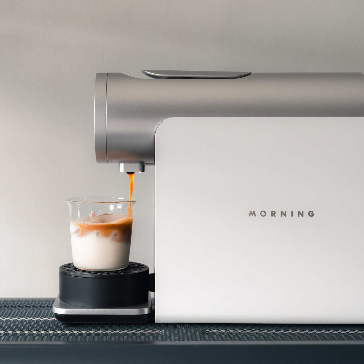 Morning Pod Machine in white pouring coffee