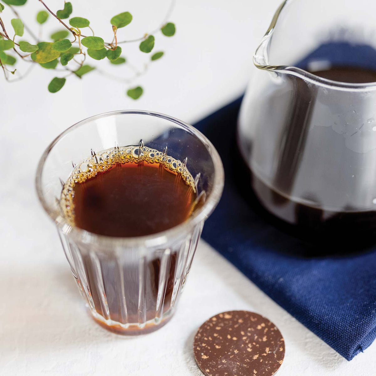 Artisan-Coffee-co_The-enigma_Chocolate-flight_jug_black-coffee_plant_glass