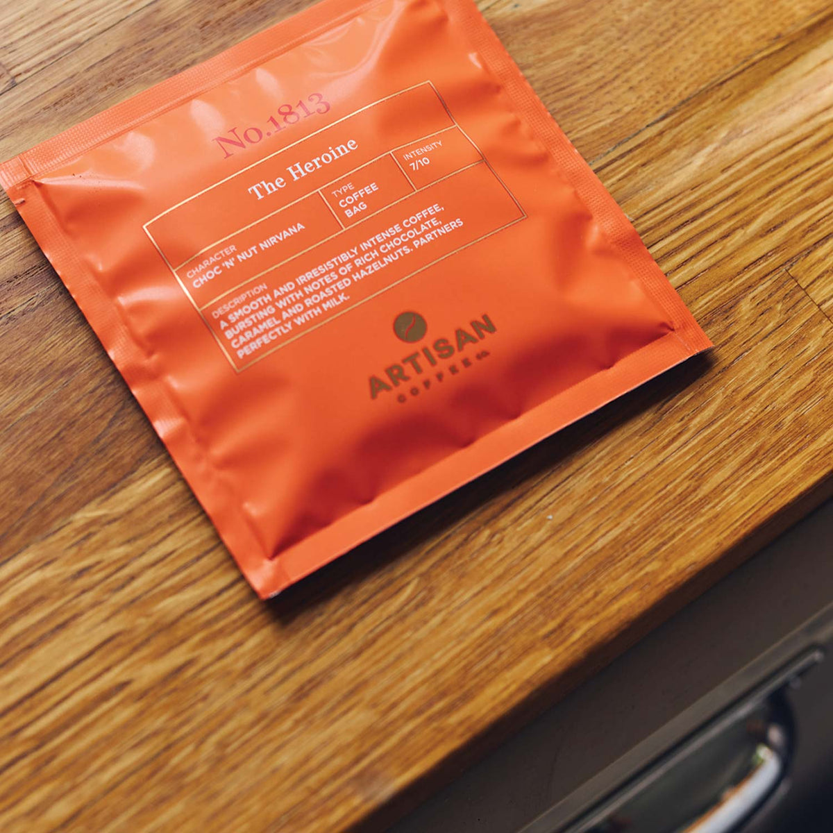 Artisan-coffee-co_the-Heroine_Coffee-bag_wooden-worktop